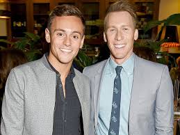 Tom daley, 26, is currently at his central london flat with his screenwriter husband dustin lance black, 45, and their toddler son robbie, along with tom's mother, amid the ongoing pandemic. Dustin Lance Black Tom Daley S Love Story Writer Tweets Sam Smith After Oscars People Com