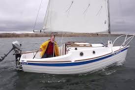 Here S A Design For Which We Stretch The Definition Of A Daysailer Since The Sage 17 Doubles As A Pocket Cruiser Cool Boats Boat Used Boats