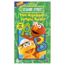 Elmo, zoe and telly are learning the alphabet by playing in the alphabet jungle; The Alphabet Jungle Game Muppet Wiki Fandom