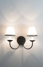 African tribal art mask parchment wall shade sconce featuring a large hide oval form with stitched and hand painted surface. Double Sconce Easy Shade Upgrade Room For Tuesday Sconces Guest Bathroom Renovation Sconce Shades