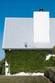 A chimney rebuild costs anywhere from $500 to $4,000 on average. Detail Of Pitched Roof And Chimney Of Modern Farmhouse Design By Rowena Naylor