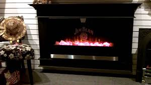 Three sided electric fireplace shown with mantel surround. Jim Beam Electric Fireplace Video Youtube