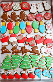 Gingerbread christmas tree cookies decorated with icing sugar and sweets. Christmas Cookies Sweetopia