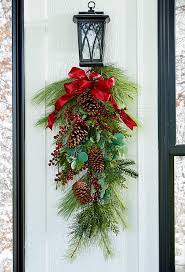 Christmas is a christian holy day that marks the birth of jesus, who christians believe to be the son of god. How To Make A Christmas Swag Wreath For Your Front Door Better Homes Gardens