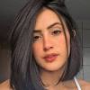 This medium length hairstyle with bangs is a jackpot for women with naturally curly hair. 1