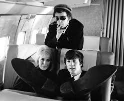 John and Cynthia Lennon with Phil Spector on board Pan Am, 1964