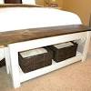 It includes two nightstands and one bed, all made from a blend of solid and engineered wood in a neutral hue. 1
