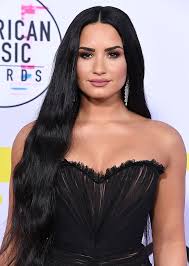 Beautiful woman speaking on mobile phone. Celebrities With Black Hair Who Ll Make You Want To Join The Dark Side