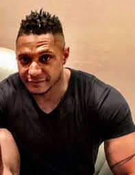 Malik Lomax Obituary