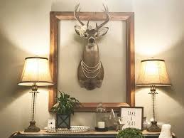 How To Beautify A Stag Head Decorate A Real Mounted Deer Head With Pearl Necklaces And A Flo Deer Heads Living Room Elegant Kitchen Decor Kitchen Decor Themes