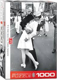 The picture portrays a u.s. Times Square V J Day Kiss Jigsaw Puzzle At Eurographics