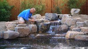 Detailing The Waterfalls Spillways Kp 55 Koi Pond Backyard Water Fountains Outdoor Pond Construction