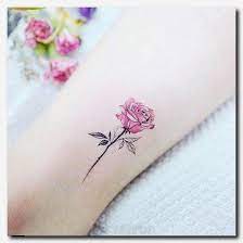 Whether you want a red, yellow, purple, white, pink or red rose on your shoulder, chest, forearm, wrist, or back, this gallery of pictures will . Choosing The Appropriate Angel Wings Tattoo Design Tattoos For Women Pink Rose Tattoos Small Rose Tattoo Tiny Rose Tattoos