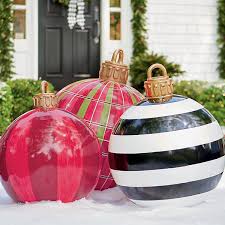 These outdoor halloween decorations can't be beat! These Oversized Christmas Ornaments Make Outdoor Decorations Stylish Again