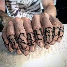 Man With Knuckle Tattoo Lettering Knuckle Tattoos Tattoos For Guys Knuckle Tattoo
