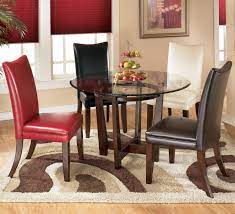 Charrell 5 Piece Round Dining Table Set With 4 Different Color Upholstered Side Chairs By Si Round Dining Room Round Dining Table Sets Round Dining Room Table