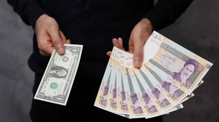 Graphiques boursiers et marchés des changes illustrant la volatilité monétaire