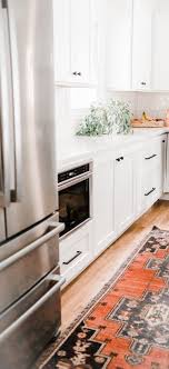 white kitchen with bright vintage rug