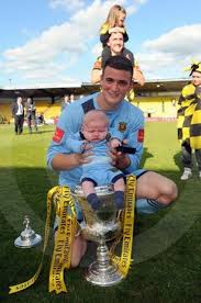 24646720-Auchinleck Talbot V Linlithgow Rose. Talbot Keeper Andy Leishman  celebrates with his son Oscar. Herald and Times Group
