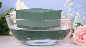 Remove any extra leaves to create clean stems. How To Make A Floral Arrangement Using A Foam Block Inside A Container
