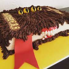 A red tongue is hanging out of the book. The Monster Book Of Monsters Cake Harry Potter Themed Birthday Party Monstercake Harry Potter Birthday Cake Harry Potter Cake Harry Potter Birthday