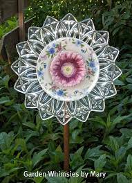 Glass Garden Flowers Made Out Of Recycled Glass Dishes Votives And Chinaware From Yard Sales Plate Flowers Garden Garden Whimsy Glass Garden Art
