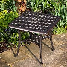 Available in a range of styles and colours including white, black, green, brown and more, a plastic table is easily stored when not in use, and won't break the bank. Sandra Square Metal Garden Coffee Table Bronze Lazy Susan