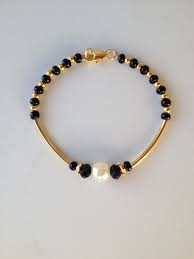 Black And Gold Bracelet For Babies Black Beaded Bracelet With Gold Tube Pulseira Preta Micanga Cristais E Tubinho Black Beaded Bracelets Beaded Bracelets Baby Jewelry Gold