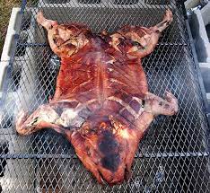 A Beginner S Guide To Roasting A Whole Pig Livinggreenandfrugally Com Pig Roast Party Roasted Hog Bbq Meat