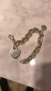Been Sitting In Box For A Few Years Now Tarnished A Bit Like Typical Silver Does Small Black Mark On Fr Tiffany Bracelets Heart Charm Bracelet Charm Bracelet