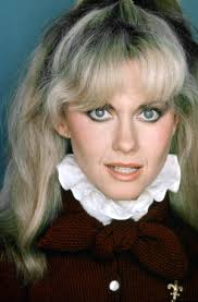 Image of Sue Upton, model and actress, December 1978. Studio pix wearing  tshirt