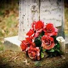 There are several stones in the the cemetery that can be read, and two of the names are female, but just dropping flowers around did nothing. Flowers On The Grave By Jae Zole