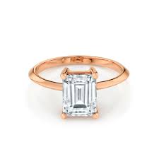 A pair of diamond baguettes and a band with pave detailing complete this alluring ring. The Odessa Emerald Cut Engagement Ring Marrow Fine