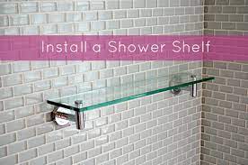 A shelf above the bar would work or simply hang things from the bar. Quick Tip How To Install A Shower Shelf Over Glass Or Ceramic Tiles Manmadediy