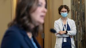 Middle finger? Health worker gestures to Danielle Smith