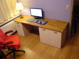 Custom ikea desk with monitor riser and cable passthru. Custom Computer Desk Ikea Hackers