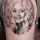 My portrait of Dolly Parton, finished today. Done by Phil Watkins at Marlow  Ink, Fairfax VA. : r/tattoos