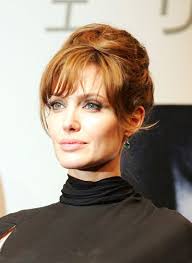 Few hairstyles look so picture perfect with a sheath dress and heels. You Must See This Not Quite French Twist On Angelina Jolie It May Be The Prettiest Soft Retro Updo In History Glamour