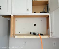 I don't know what is above it but since you have an over the range you can use the mounting screws. Building A Microwave Shelf The Stonybrook House