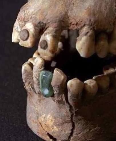Ancient Maya skull with jade and pyrite teeth inlays