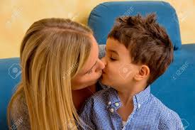 A Little Boy With A Woman Being Kissed Stock Photo, Picture and Royalty  Free Image. Image 35525647.