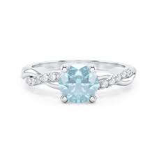 Découvrez cette bague de haute joaillerie : Bague Entrelacee Flamme Argent Aigue Marine Et Diamants Divenly