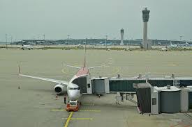 Photo about background, journey, architecture, boarding, gate, modern, flight, airline, light, landing, departure, business, . A Commercial Aeroplane Connected To The Passenger Boarding Bridge In Incheon International Airport Seoul South Korea Editorial Photography Image Of Gangway Large 118631737