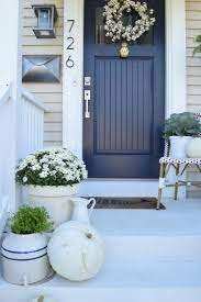 The door has a window and a transom right above it. Fall Ideas For Front Porch And Eclectic Fall Home Tour Exterior House Colors Painted Front Doors Exterior Paint Colors For House