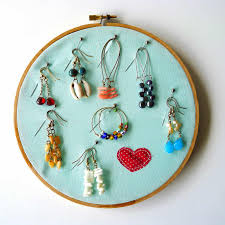 You can paint or decorate them however you want and then just hang them on the wall to hold necklaces and bracelets. All Too Easy Delightful Dollar Store Embroidery Hoop Crafts