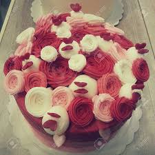Red velvet cake is a classic. Red Velvet Cake With Rose Icing Decoration Stock Photo Picture And Royalty Free Image Image 24701206