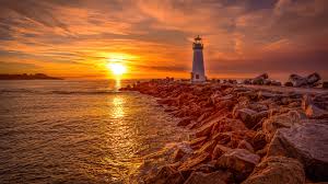 We hope you enjoy our growing collection of hd images to use as a background or home screen for your smartphone or 1920x1080 nature sunset ocean lying sun 4k laptop full hd 1080p hd>. Lighthouse Sunrise And Sunset 4k Hd Desktop Wallpaper Widescreen High Definition Fullscreen