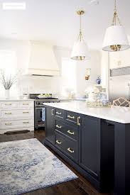 I like the black stone in the backsplash. Black And White Kitchen With Gold Hardware Instaimage