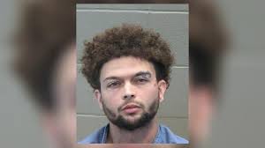 Man accused of driving from traffic stop, taking officer with him, formally  charged