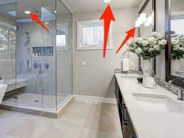 The slate tile, the tankless toilet, the modern vases in the window. Interior Designers Reveal Mistakes To Avoid When Designing A Bathroom